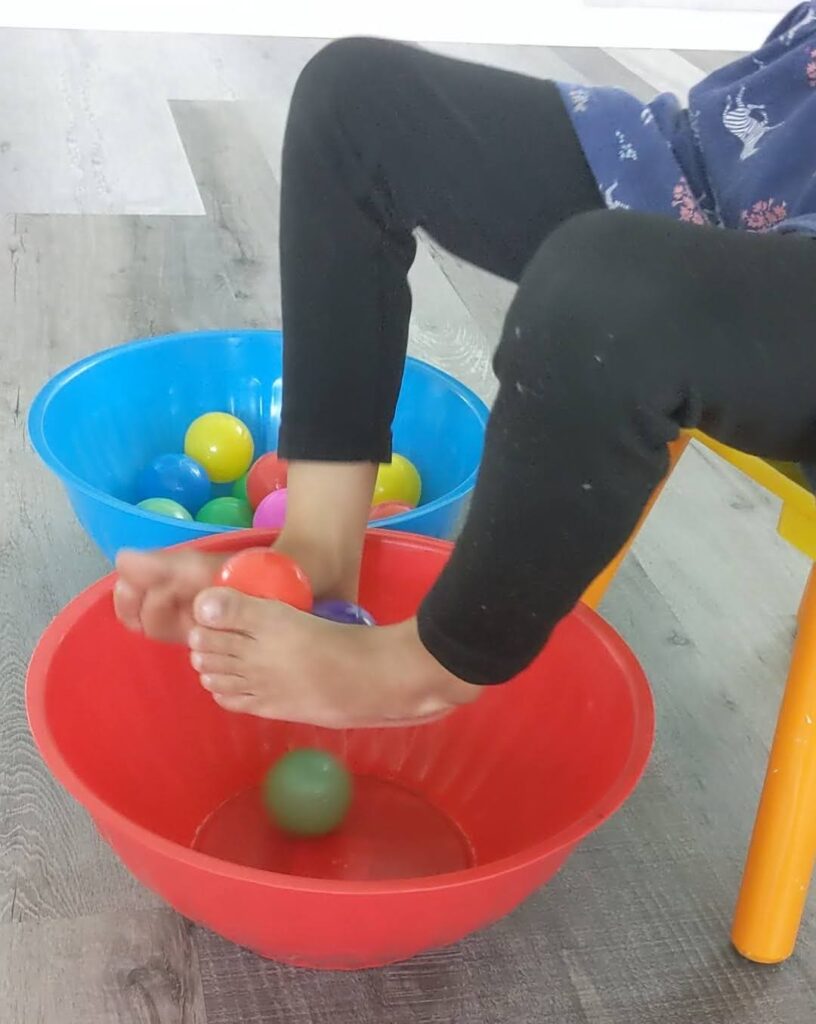 Transfer balls with feet indoor activity